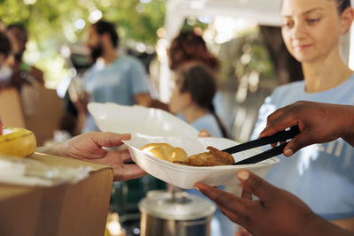 Midsection of man preparing food