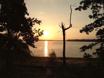 Scenic view of sea against sky at sunset