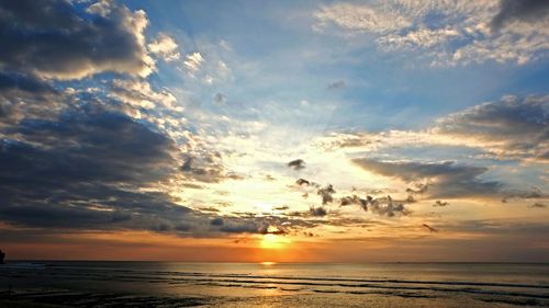 Scenic view of sea at sunset