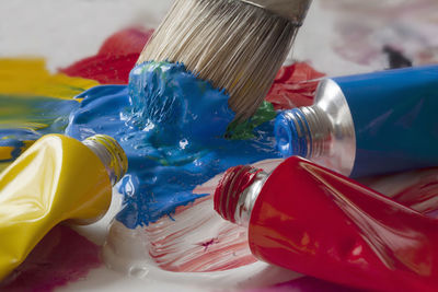 Close-up of blue paint on table