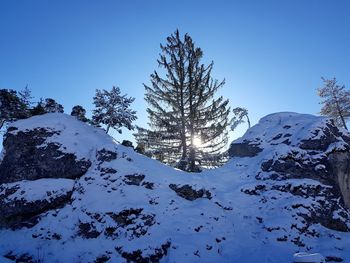 Scenic view of snowcapped mountains against clear blue sky