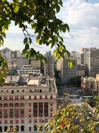 Buildings in city against sky