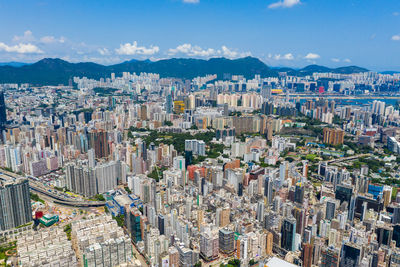 High angle view of city buildings against sky