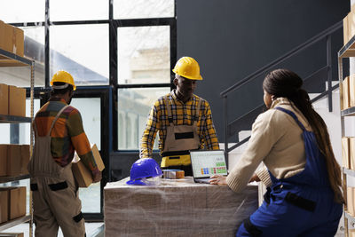 Rear view of man working at construction site