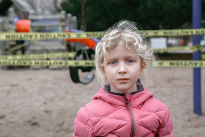 Portrait of cute girl wearing pink jacket