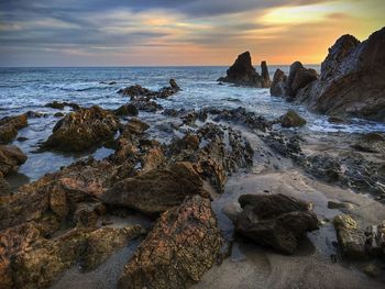 Scenic view of sea at sunset