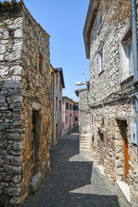 Old houses on a narrow street in maenza, a medieval village near rome in italy.