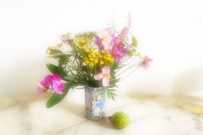 Close-up of flower vase against white background