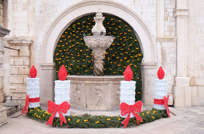 Small onofrio fountain decorated with advent wreaths and candles in dubrovnik, croatia