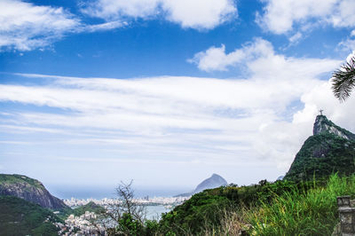 Scenic view of mountains against cloudy sky