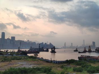 Scenic view of bay against sky during sunset