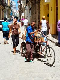 People walking on street in city