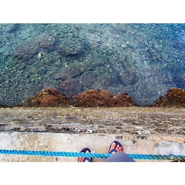 water, sea, transfer print, beach, auto post production filter, low section, blue, shore, high angle view, sand, person, leisure activity, tranquility, nature, lifestyles, day, outdoors, standing