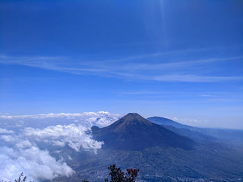 Scenic view of snowcapped mountain against cloudy sky