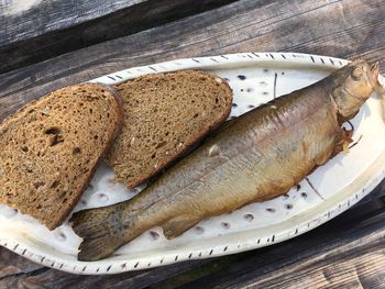 High angle view of fish in plate on table