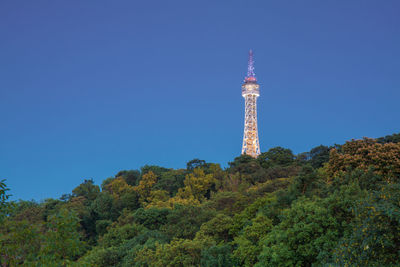 Prague lookout tower after dark. built on petrin hill, sometimes also called small eiffel tower.