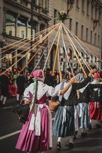 People on city street during traditional festival