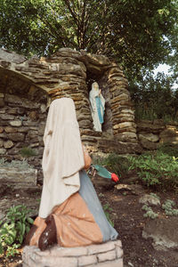 Rear view of women walking in forest