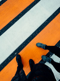 Low section of man standing on floor