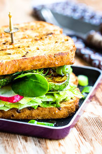 Close-up of sandwich in tray on table