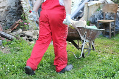 Low section of man working on field