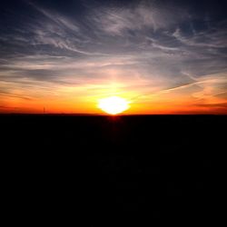 Silhouette landscape against sky during sunset