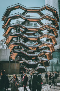 People walking on building in city