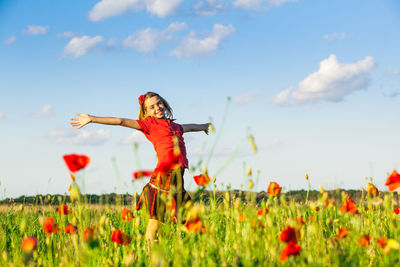 View of person standing on field against sky