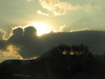 Scenic view of silhouette mountains against sky at sunset