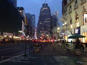 Illuminated city street at night