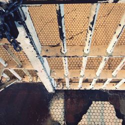 Low section of man standing on tiled floor