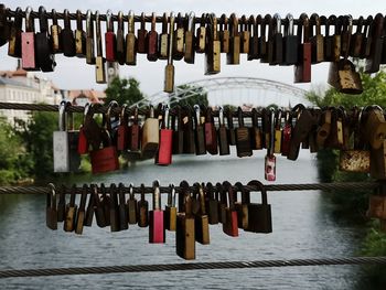 Row of padlocks hanging on river