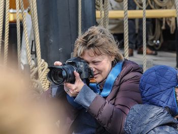 Portrait of woman photographing