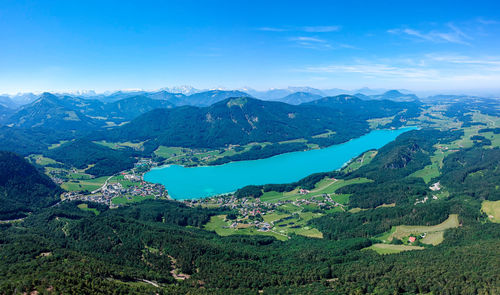 Scenic view of mountains against blue sky