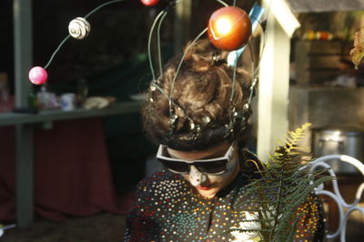 Close-up of woman in costume with painted face