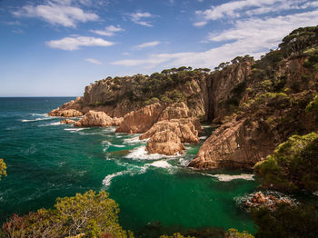 Scenic view of sea and cliff