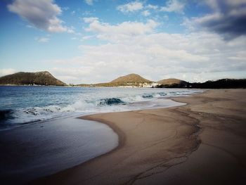 Scenic view of beach against sky