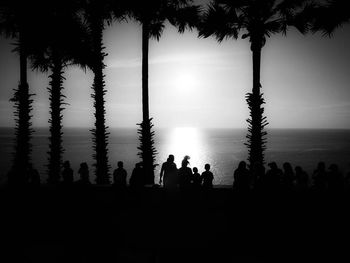 Silhouette of people at sunset