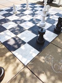 High angle view of chess pieces on floor