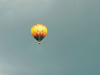 Low angle view of hot air balloons against sky