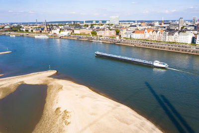 High angle view of river by buildings in city