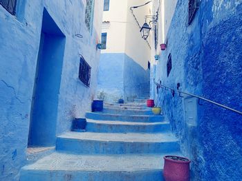 Empty alley amidst houses in town