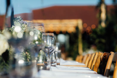 Luxury table settings for fine dining with and glassware, pouring wine to glass.beautiful background