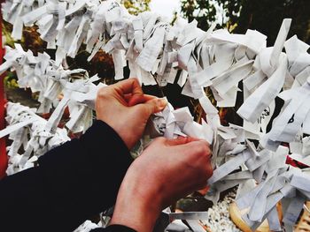 High angle view of people holding paper