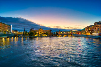 Illuminated city at waterfront