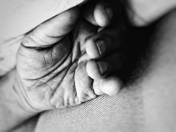 Close-up of person sleeping on bed