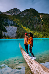 Couple at lake against mountains