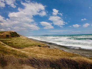 Scenic view of beach against sky