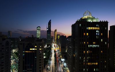 Illuminated buildings in city at night