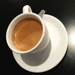 High angle view of coffee cup on table